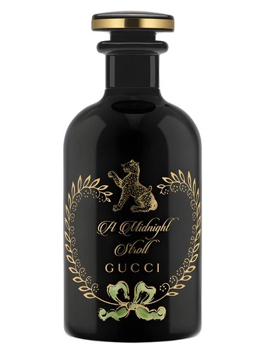 A Midnight Stroll perfume bottle, front label visible